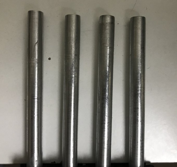 A picture of steering shafts that we had to mill down from 8mm to 7.8mm using nothing but a hand- drill and sandpaper